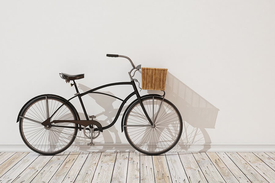 Bicycle leaning against a wall